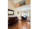 The dining room has a wet bar, wood floors, and a table that sits eight with large windows at 2050 Lake Circle Dr, Thornton, CO 80241