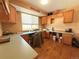 A dedicated home office space with custom cabinetry, built-in desk, and natural light at 2050 Lake Circle Dr, Thornton, CO 80241