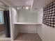 Small office area featuring built-in desk, lighting and tile floor at 2050 Lake Circle Dr, Thornton, CO 80241