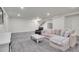 The finished basement has neutral paint, recessed lighting, and carpeted floors at 16060 Fairway, Commerce City, CO 80022