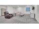 This finished basement has a comfortable seating area, lots of room and natural light at 16060 Fairway, Commerce City, CO 80022