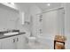 This bathroom has updated vanity, a tub, shower, and storage cabinet at 16060 Fairway, Commerce City, CO 80022