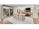 Bright dining area with a view of the backyard through sliding glass doors at 16060 Fairway, Commerce City, CO 80022