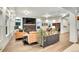 Elegant living room featuring a fireplace, stylish decor, and abundant natural light at 16060 Fairway, Commerce City, CO 80022