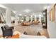 Open-concept living area with hardwood floors, comfortable seating, and an inviting atmosphere at 16060 Fairway, Commerce City, CO 80022