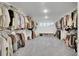 Spacious walk-in closet with custom shelves and ample storage space for clothing and accessories at 16060 Fairway, Commerce City, CO 80022
