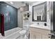 Bathroom with modern tile, vanity, and shower-tub combination at 6360 W 1St Ave, Lakewood, CO 80226