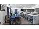 Modern kitchen and dining area with a large island, sleek cabinetry, and a stylish dining table at 6360 W 1St Ave, Lakewood, CO 80226
