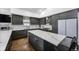 Modern kitchen with stainless steel appliances, white countertops, and sleek cabinets for a contemporary look at 6360 W 1St Ave, Lakewood, CO 80226