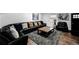 Well-decorated living room with comfortable seating, stylish rug, and plenty of space to relax at 6360 W 1St Ave, Lakewood, CO 80226