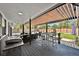 Outdoor patio with a grill, dining table, pergola, and a fenced yard at 6360 W 1St Ave, Lakewood, CO 80226