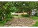 Landscaped backyard featuring patio and mature trees at 4580 S Huron St, Englewood, CO 80110