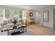 Bright living room with hardwood floors, neutral walls, large windows, and a welcoming atmosphere at 4580 S Huron St, Englewood, CO 80110