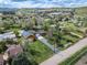 Aerial view of a house with a long driveway surrounded by lush greenery and scenic views of the mountains at 1415 Isabell St, Golden, CO 80401