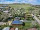 Aerial view of the house showing the well-maintained lawn, solar panels, and lush surroundings at 1415 Isabell St, Golden, CO 80401