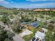 Aerial view of the home with solar panels on the roof and overlooking the lush surroundings at 1415 Isabell St, Golden, CO 80401