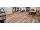 Open basement area with hardwood floors, kitchenette, bar, and recreational space at 1415 Isabell St, Golden, CO 80401