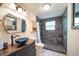Bathroom featuring a slate shower, a pebble floor, a vessel sink and decorative vanity at 1415 Isabell St, Golden, CO 80401