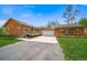 Charming single-Gathering home featuring a log cabin exterior, deck, well-manicured lawn, and a two-car garage at 1415 Isabell St, Golden, CO 80401