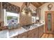 Kitchen with granite counters, stainless appliances, pantry, wooden ceiling and decorative tile backsplash at 1415 Isabell St, Golden, CO 80401