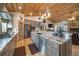 Kitchen with stainless steel appliances, custom cabinetry, wooden ceiling, and granite countertops at 1415 Isabell St, Golden, CO 80401