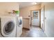 Efficient laundry room with modern appliances and convenient exterior access at 1415 Isabell St, Golden, CO 80401