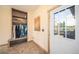 Functional mudroom featuring a storage bench with shelving and exterior access at 1415 Isabell St, Golden, CO 80401