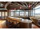 Entertaining bar area featuring granite countertops, seating, and modern lighting at 12930 Bobcat Ct, Broomfield, CO 80021