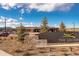 View of the community entrance showcasing manicured landscaping and signage at 12930 Bobcat Ct, Broomfield, CO 80021