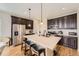 Spacious kitchen with a large center island, dark cabinets, and stainless steel appliances at 12930 Bobcat Ct, Broomfield, CO 80021