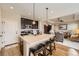 Modern kitchen with a large island, stainless steel appliances, and sleek dark cabinetry at 12930 Bobcat Ct, Broomfield, CO 80021
