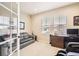 Cozy home office with a comfortable sofa, natural light, and ample workspace at 12930 Bobcat Ct, Broomfield, CO 80021