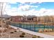 Outdoor tennis courts with scenic views of the surrounding landscape and mountains at 12930 Bobcat Ct, Broomfield, CO 80021