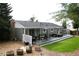 Inviting deck offers outdoor seating, a hot tub, and is surrounded by a well-maintained yard at 1008 Park View Ct, Castle Rock, CO 80104