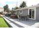 Well-designed backyard deck equipped with a hot tub and outdoor dining area at 1008 Park View Ct, Castle Rock, CO 80104