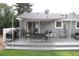 Relaxing backyard deck with a grill, seating, and shade, perfect for outdoor enjoyment at 1008 Park View Ct, Castle Rock, CO 80104