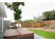 Private backyard with a large deck featuring a hot tub and outdoor dining area at 1008 Park View Ct, Castle Rock, CO 80104