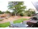 Backyard features a spacious deck with a hot tub and outdoor dining, surrounded by a privacy fence at 1008 Park View Ct, Castle Rock, CO 80104