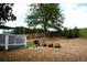 The backyard features a deck, grill, mulch, and a large mature shade tree at 1008 Park View Ct, Castle Rock, CO 80104