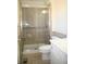 Bathroom featuring tiled shower and glass door at 1008 Park View Ct, Castle Rock, CO 80104