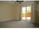Carpeted bedroom with sliding glass door leading to a patio and backyard at 1008 Park View Ct, Castle Rock, CO 80104
