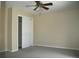 Cozy bedroom featuring a ceiling fan and closet with sliding doors at 1008 Park View Ct, Castle Rock, CO 80104