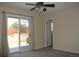 Bright bedroom features sliding glass door access to the backyard patio at 1008 Park View Ct, Castle Rock, CO 80104