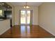 Dining area features hardwood floors and french doors leading to the backyard at 1008 Park View Ct, Castle Rock, CO 80104