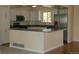 Updated kitchen showcases white cabinets, stainless steel appliances, and a breakfast bar for modern living at 1008 Park View Ct, Castle Rock, CO 80104