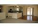 Bright, eat-in kitchen features white cabinets, stainless appliances, and a breakfast bar with countertop seating at 1008 Park View Ct, Castle Rock, CO 80104