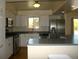 Modern kitchen with stainless appliances, white cabinets, and ample counter space for cooking and entertaining at 1008 Park View Ct, Castle Rock, CO 80104