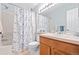 Bathroom with shower/tub, toilet, and oak vanity at 3748 Oakwood Dr, Longmont, CO 80503