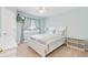 Cozy bedroom boasts natural light, ceiling fan, and a wall mounted TV at 3748 Oakwood Dr, Longmont, CO 80503