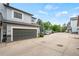 Attached garage offers convenience with ample parking in a well-maintained community setting at 3748 Oakwood Dr, Longmont, CO 80503